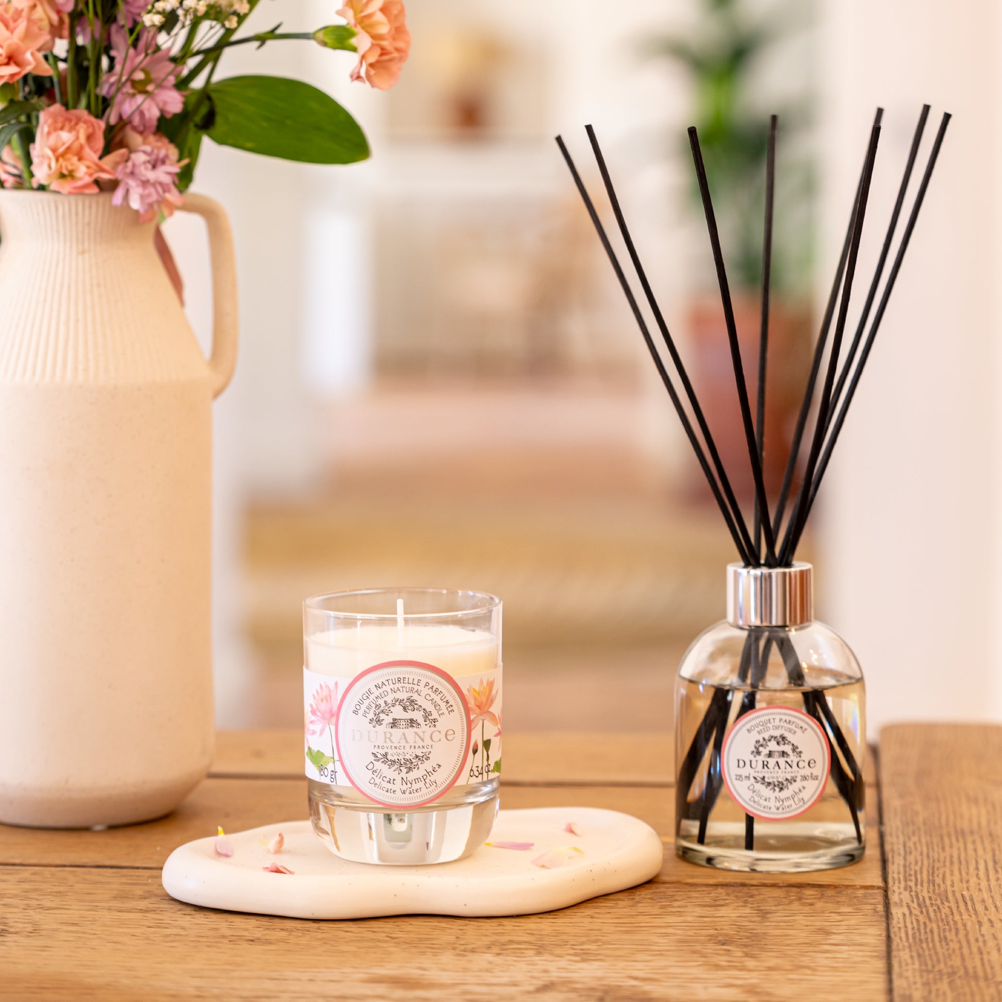 Delicate Water Lily Candle in a glass jar with a Durance label  and a diffuser