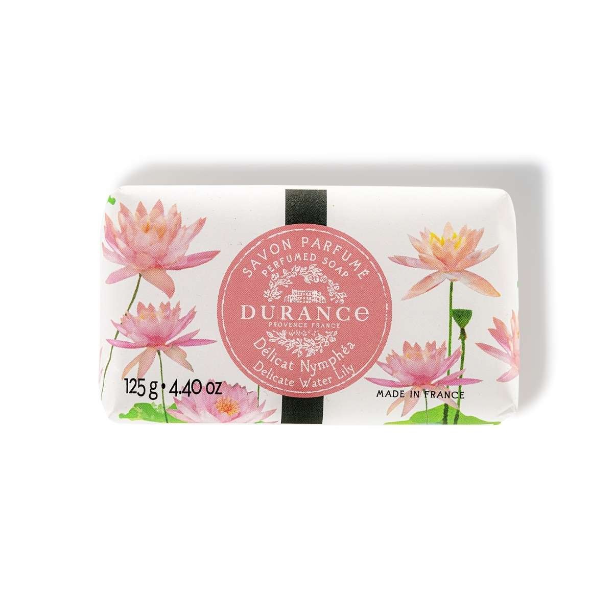 A bar of Durance branded soap with 'Delicate Water Lily' scent, featuring floral designs on the packaging.