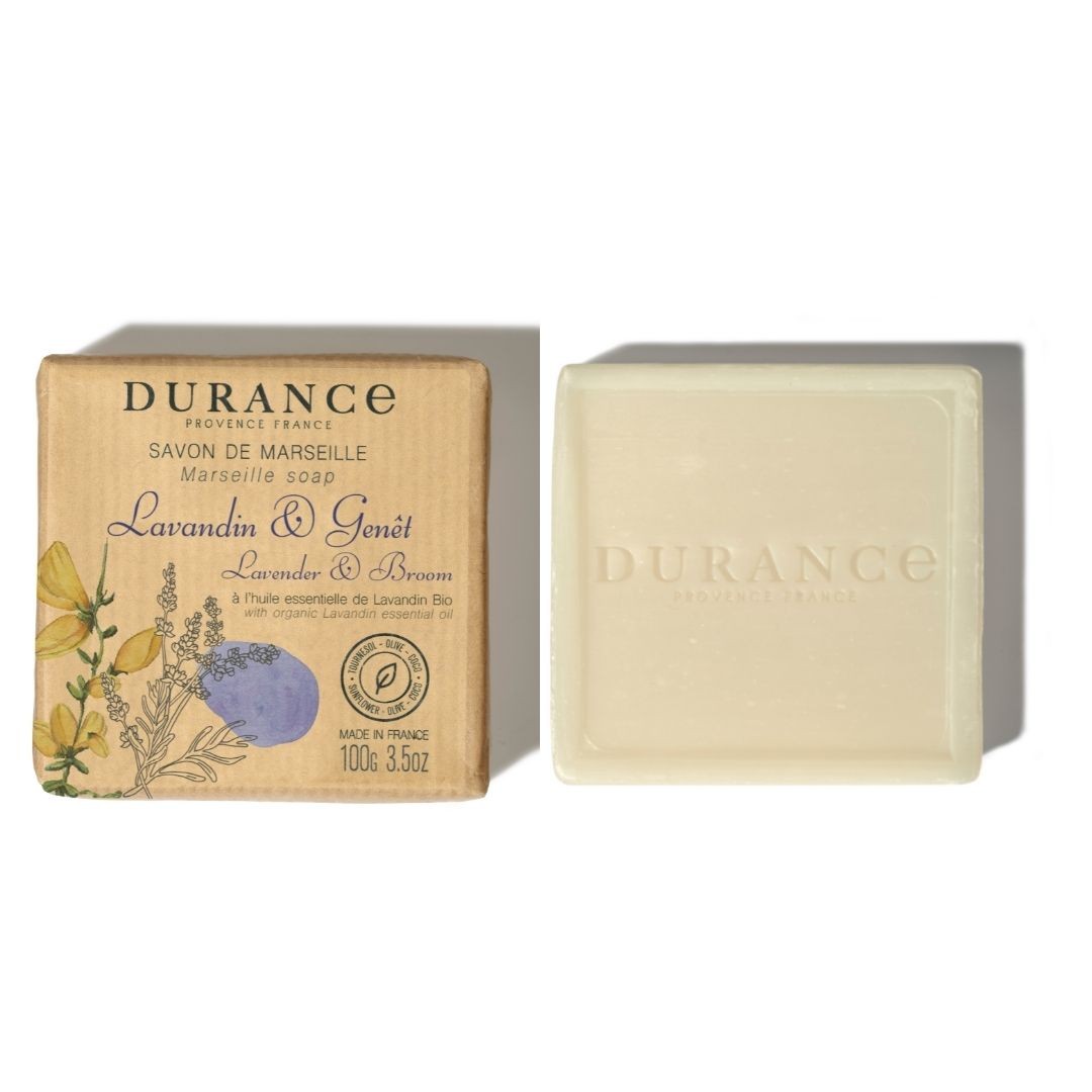 A bar of Durance Marseille soap with lavender and broom scents, packaged in a cardboard box with floral designs and product information.