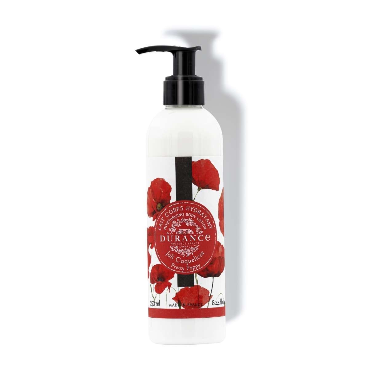 A pump bottle of Durance Pretty Poppy Moisturizing Body Lotion with a design of red poppies on the label.