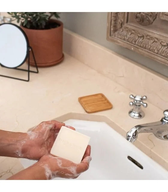 Rose & Saffron Solid Soap being used to wash hands