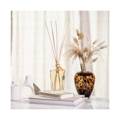 Wooden sticks  and orange diffuser
